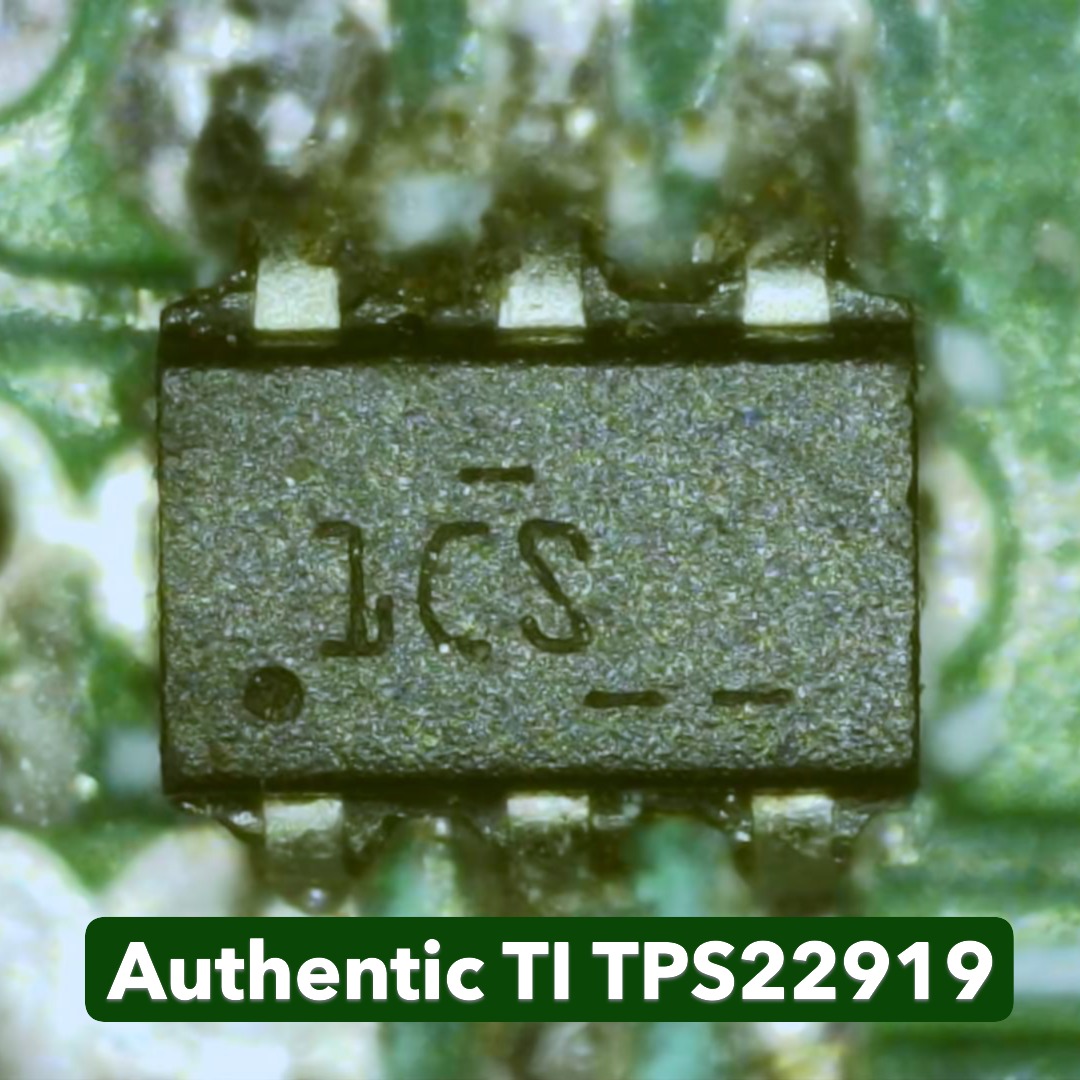 Microscope close-up of the genuine Texas Instruments TPS22919 load switch IC in SC-70 package mounted on the Ramanu Systems PureSwitch-22919 module